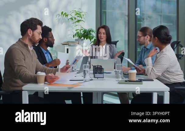 Diversity business team emotional discussing papers talking at company ...