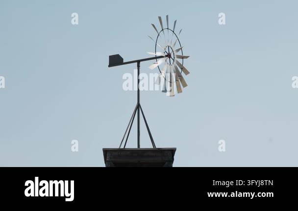 Decorative metal windmill spinning