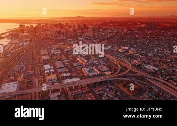 Downtown San Diego bathed in the warm, golden light of sunset ...