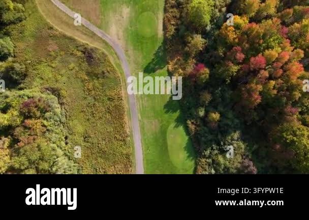 Aerial drone footage of a golf course during autumn, showing colorful ...