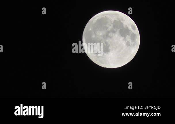 Atmospheric cinematic night video of a glowing moon under a mystical ...