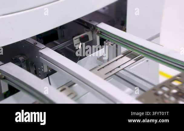 Circuit board panel moving on conveyor in SMT line. Automated ...