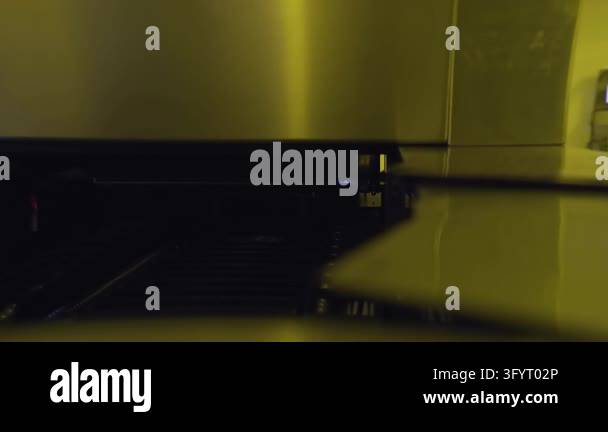 Cleanroom 360 Blue light inside automated machine at electronics factory. Circuit ...