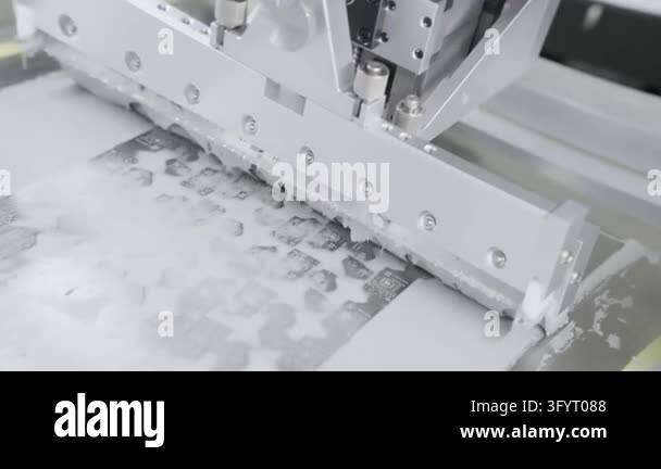 Screen printing machine squeegee moves over circuit board. PCB printing ...