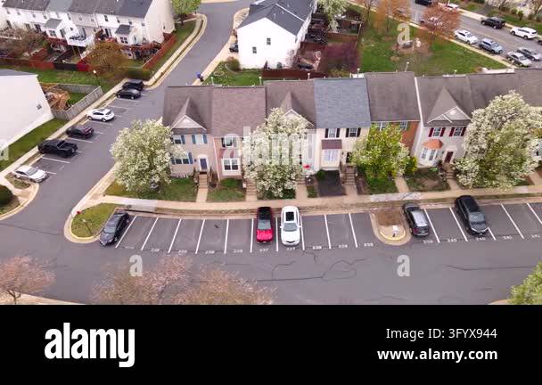 Virginia Apple Tree Apple blossoms frame residential architecture along a suburban street ...