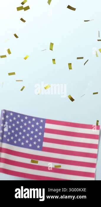 Animation of confetti falling over hand holding flag of united states ...