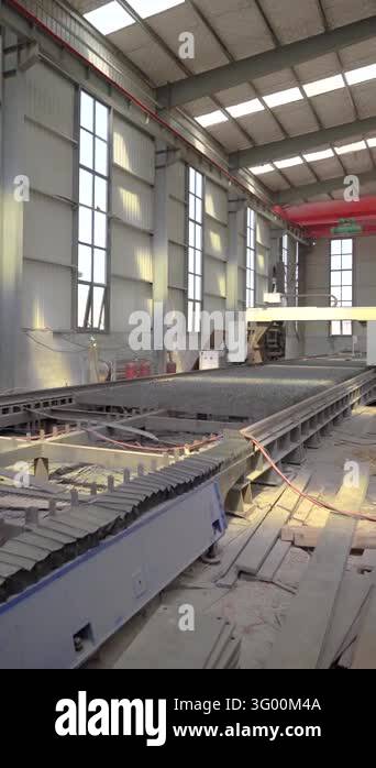 Wide vertical view of a large steel cutting table and industrial ...