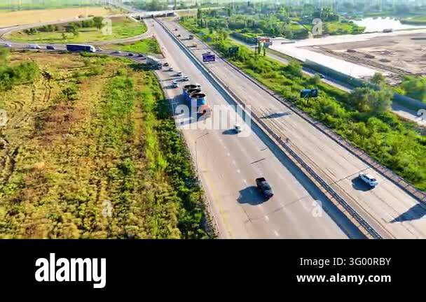 Oversized freight transportation on an extended trailer along a divided ...