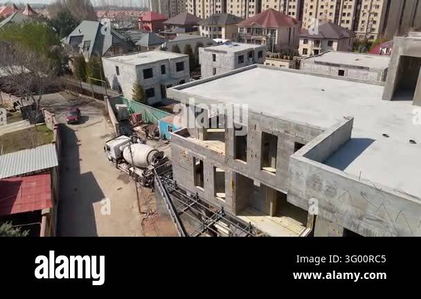 Structural Flaming Concrete Building Construction Site with Cement Mixer Truck Aerial View ...