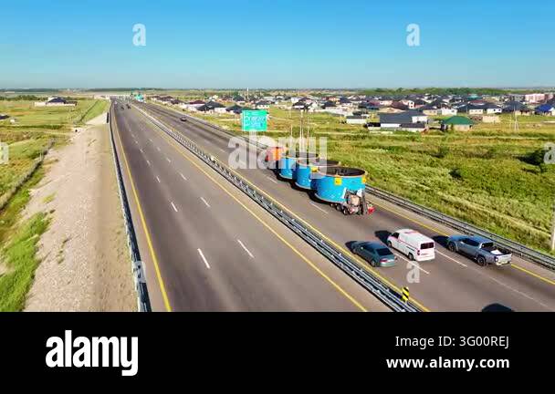 Oversized road freight transportation on a divided highway among ...