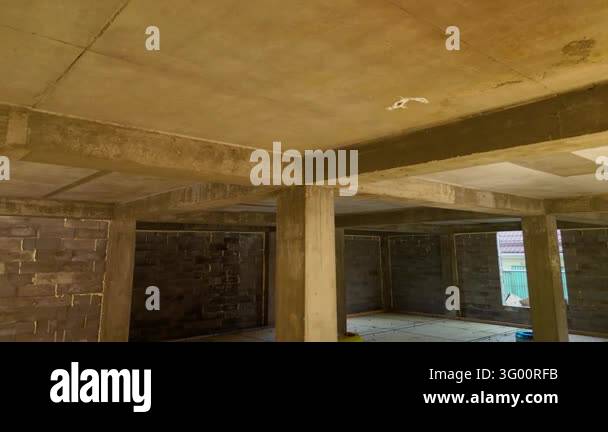 Structural Flaming Unfinished Building Interior with Concrete Columns and Structural Beams ...