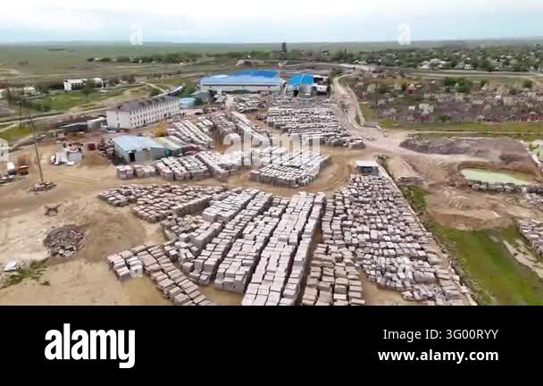 Wide Drone Survey of Industrial Yard and Stacked Building Materials ...