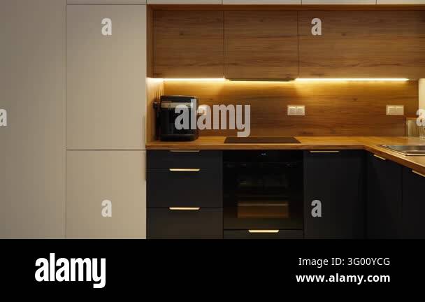 Custom kitchen furniture combines wooden upper cabinets, dark matte ...