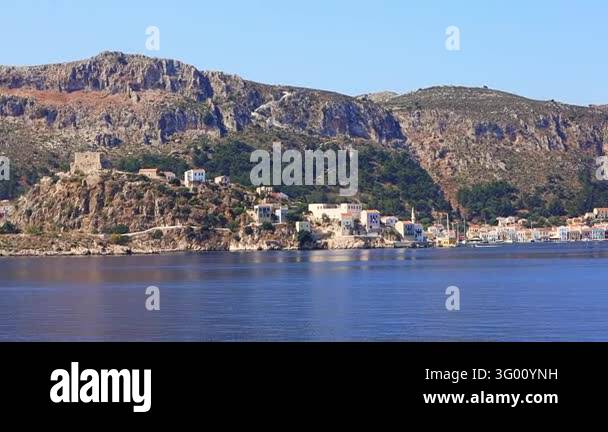Kastellorizo island in Greece features a serene harbor surrounded by ...