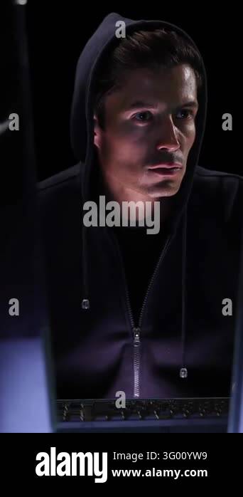 Animation of icons over caucasian hacker using computer. global science ...