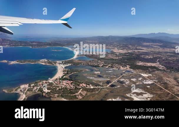 Panoramic view from an airplane window showing the wing and the ...