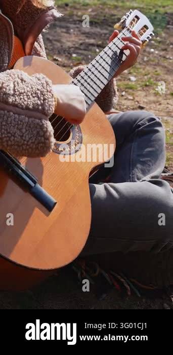 Instrument Land Close up of hands playing acoustic guitar and singing relaxing enjoying ...