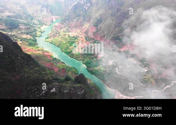 An aerial view follows the river through mountain valleys on the Ha ...