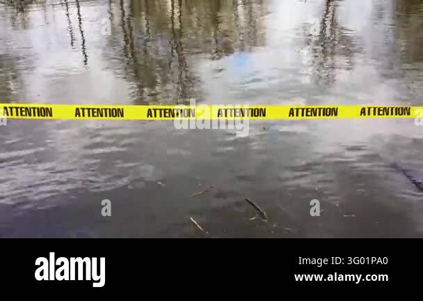 Yellow Attention Warning Tape Across Flooded Area During High Water ...