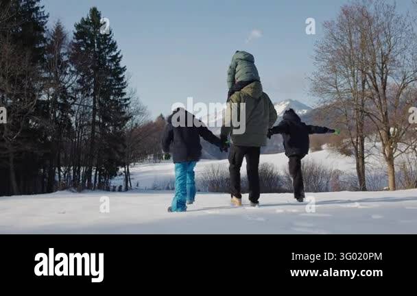 Family bonding and togetherness as a father and his three sons enjoy a ...