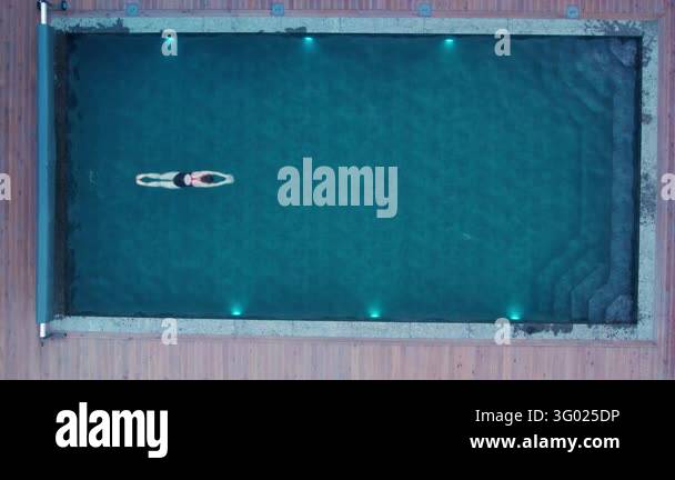 Top angle shot of female athlete training breaststroke in outdoor ...