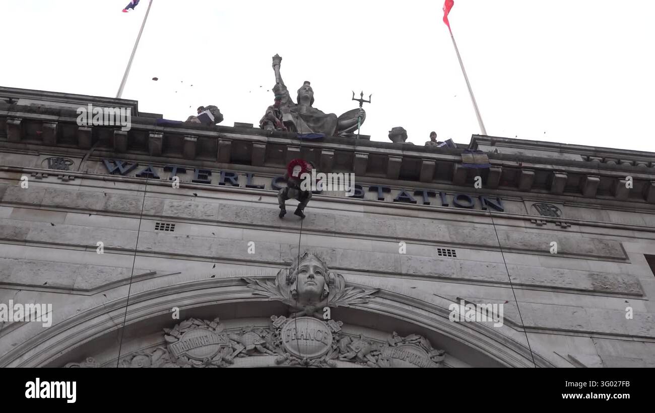 Captain Service Alphas Royal Marines abseil down Waterloo station arch on Poppy London Day ...