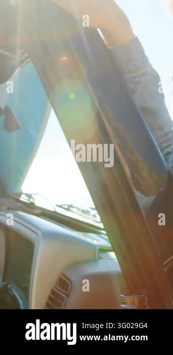 Vertical video: Woman singing in car, friend blocking sun and sparking ...