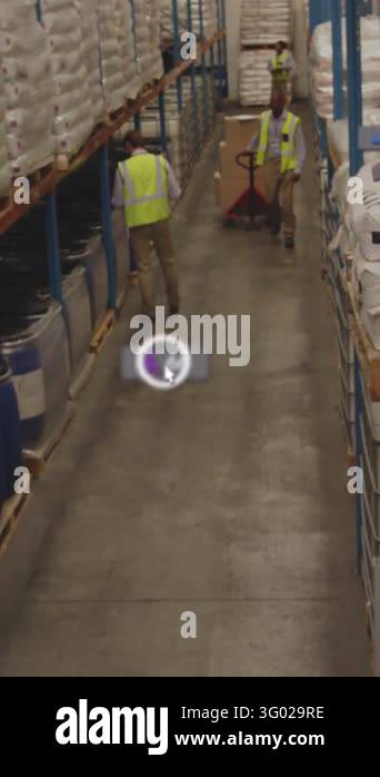Male worker starting pallet truck down warehouse aisle for stock, UI ...