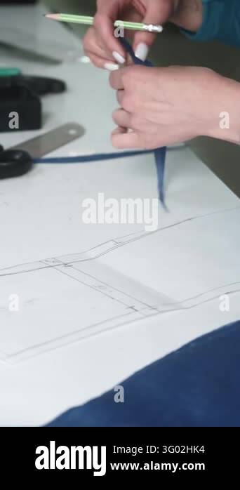 Vertical video. Sewing workshop. Apparel manufacturing. Female fashion ...