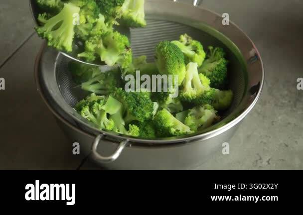 Removing Blanched Broccoli Florets with a Slotted Spoon Stock Video ...