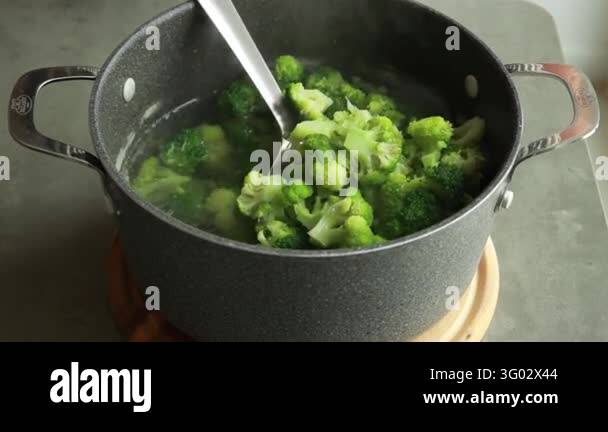 Removing Blanched Broccoli Florets with a Slotted Spoon Stock Video ...