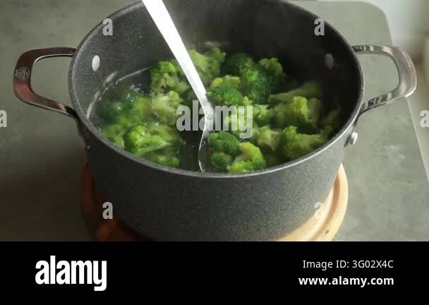 Removing Blanched Broccoli Florets with a Slotted Spoon Stock Video ...
