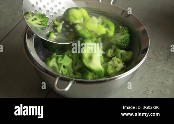 Removing Blanched Broccoli Florets with a Slotted Spoon Stock Video ...