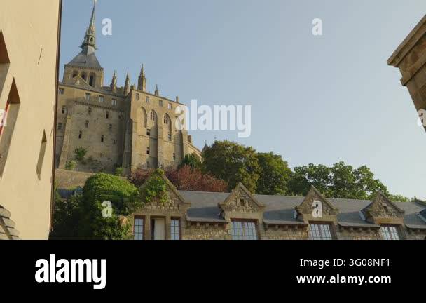 France Tree Mont Saint Michel Abbey rises above historic stone buildings and slate ...