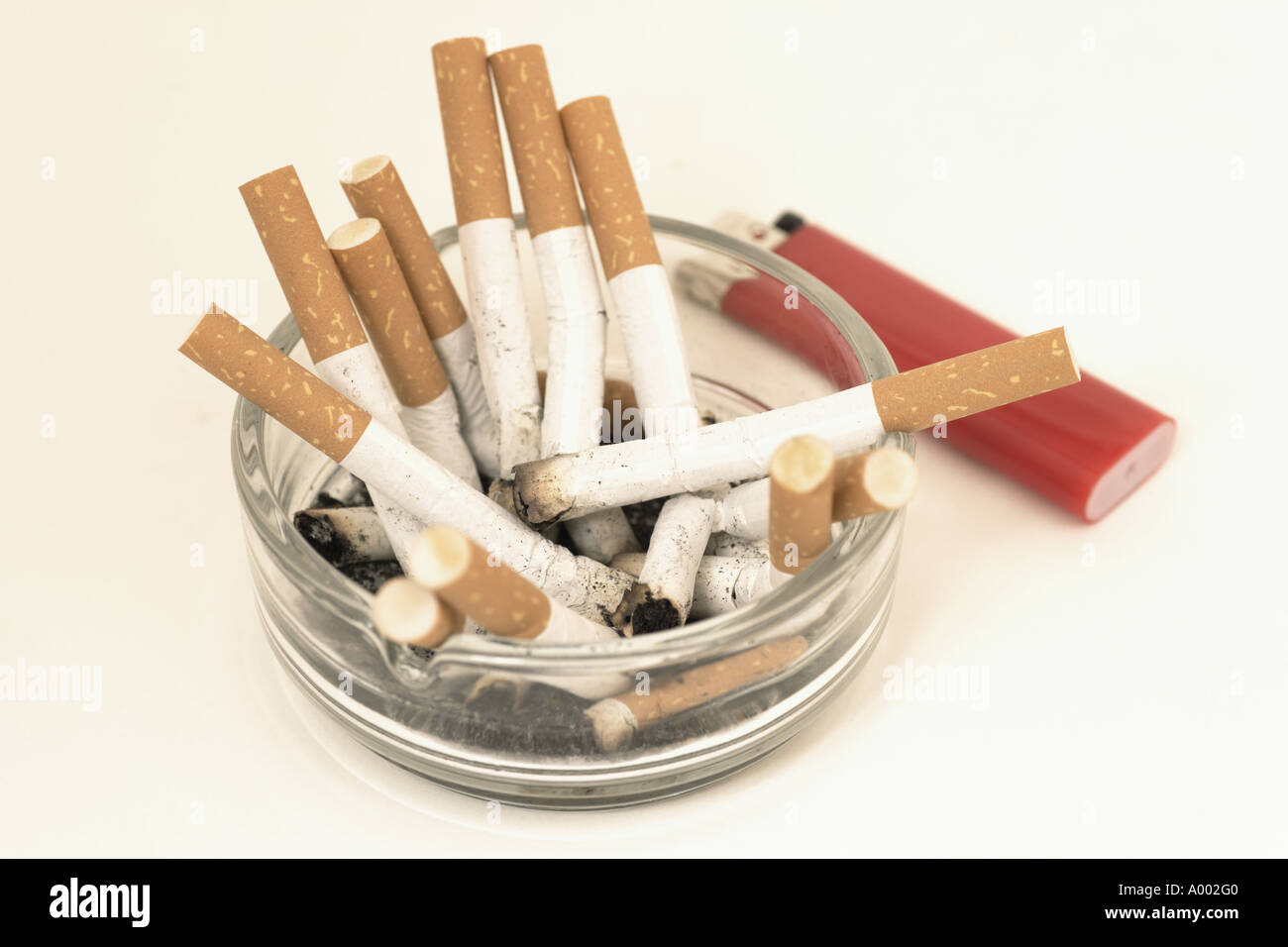 stubbed out cigarette Cigarettes stubbed out in a ashtray Stock Photo
