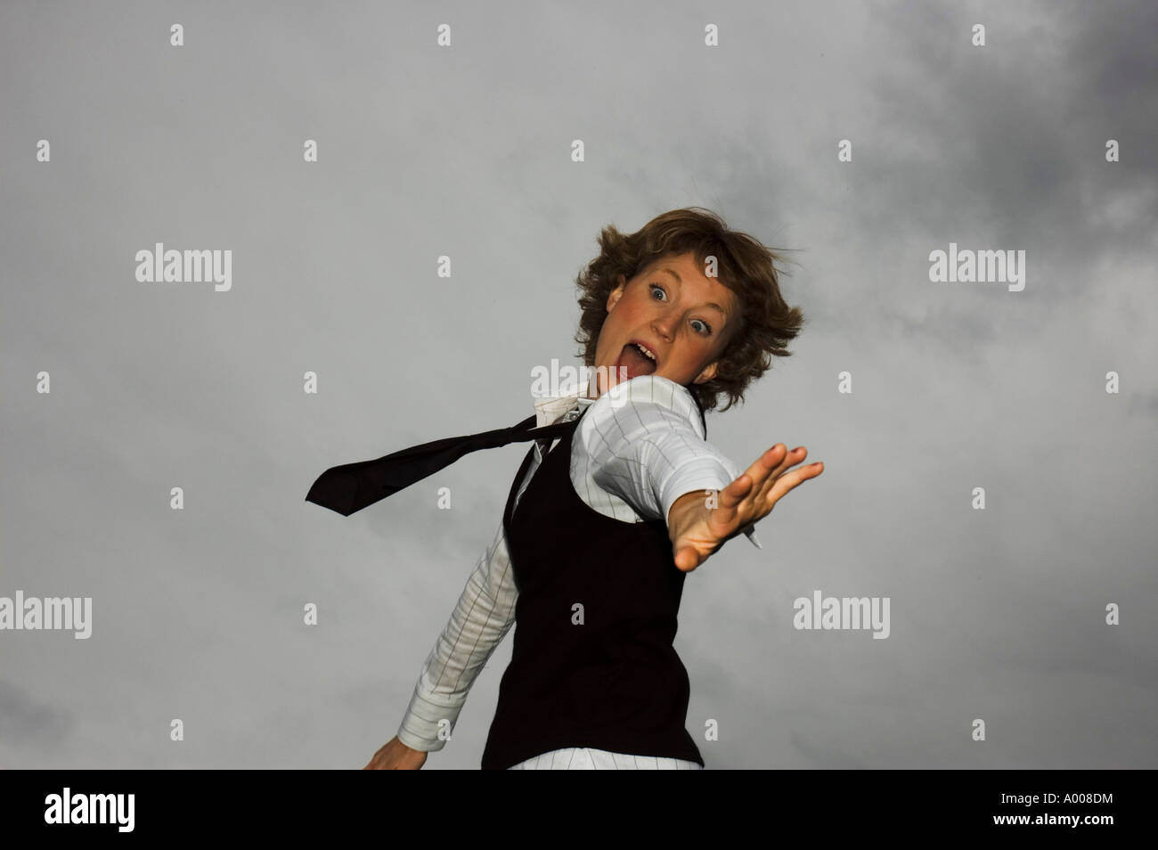 Excited woman jumping celebrating success hi-res stock photography and ...