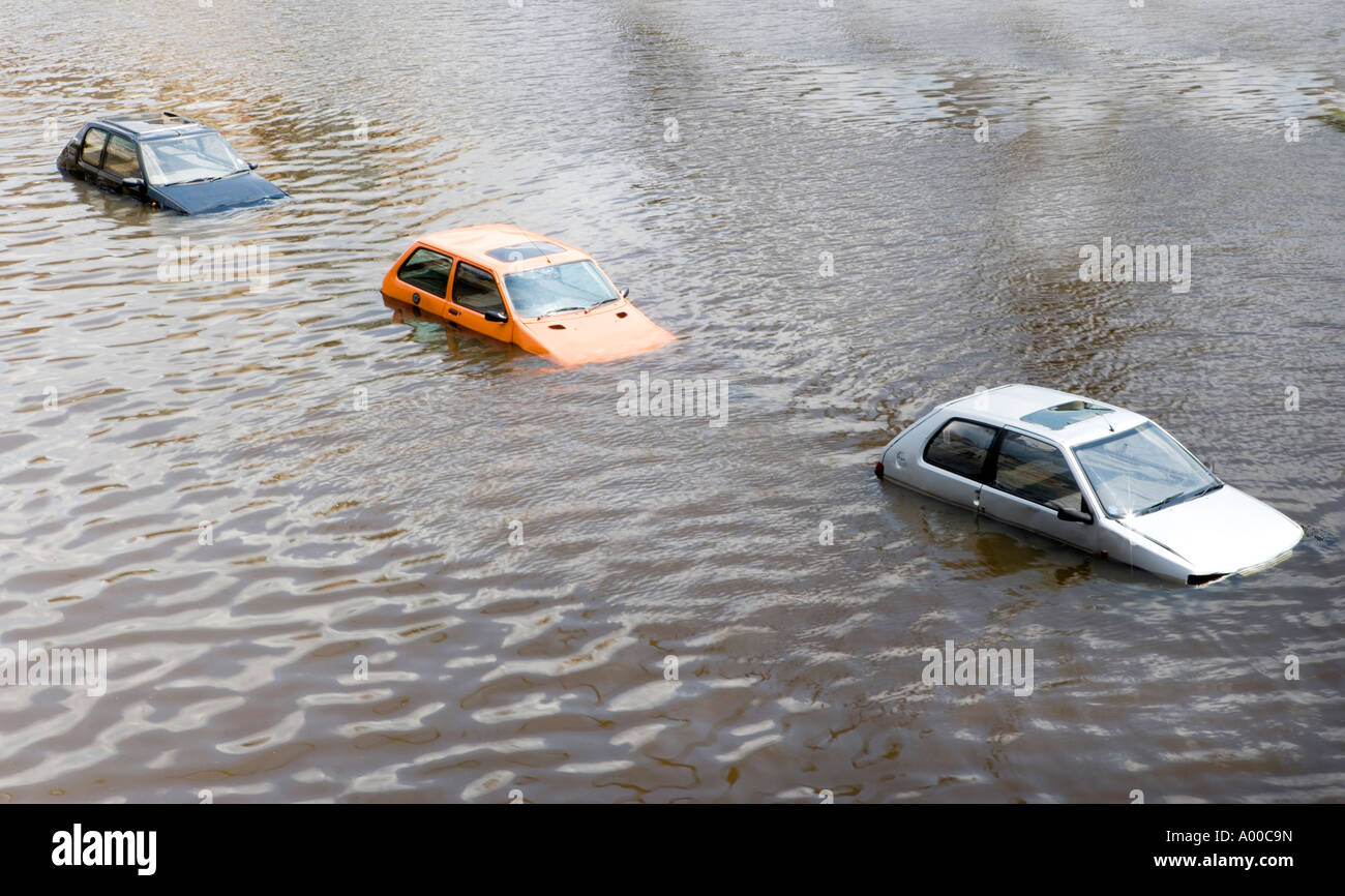 Cars floating under the Millenium bridge in the River Tyne between Gateshead and Newcastle upon Tyne. UK Stock Photo