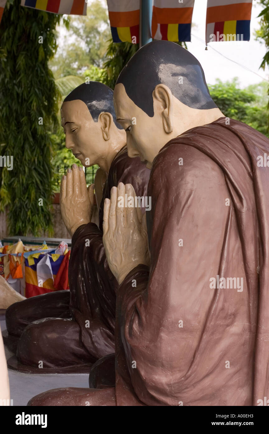 Statues showing Buddha disciples hearing first Buddha teachings in Sarnath Varanasi Bihar India Stock Photo