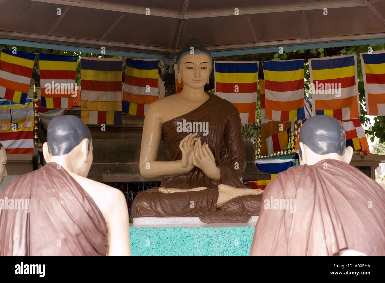 statues showing Buddha giving his first teachings in Sarnath Varanasi Bihar India Stock Photo