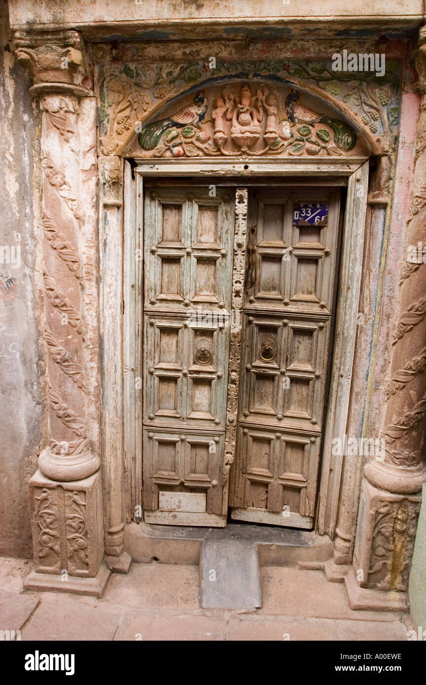 Old wooden rich carved door in old city center Varanasi Uttar Pradesh India Stock Photo