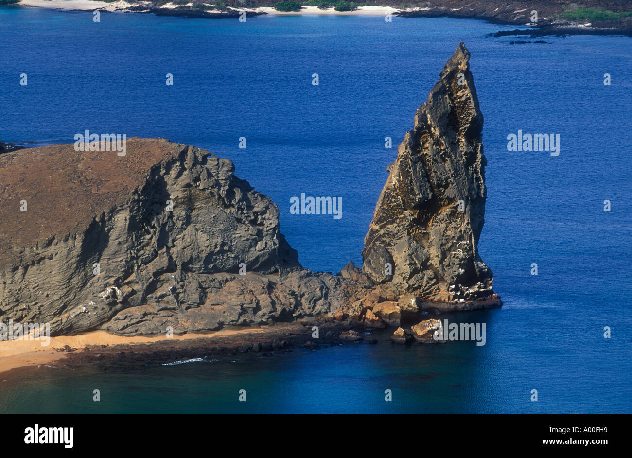 Pinnacle Rock Bartolome Island Galapagos an ancient volcanic plug and well known landmark Stock Photo