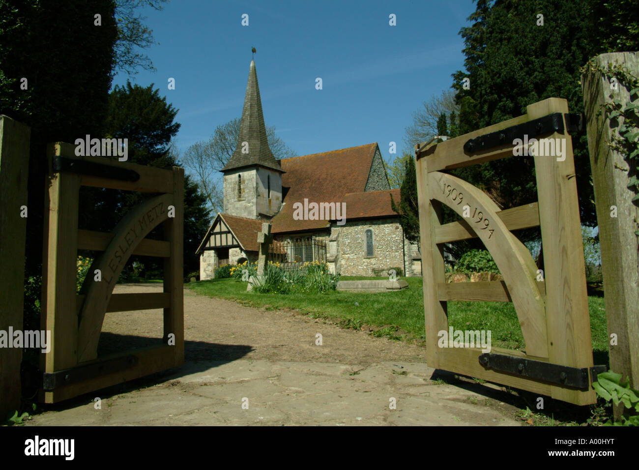 English churchyard and blue sky with gate chaldon village Stock Photo