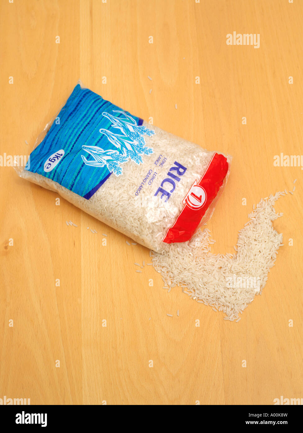Bag of Long Grain Rice with Some Spilling Out Stock Photo