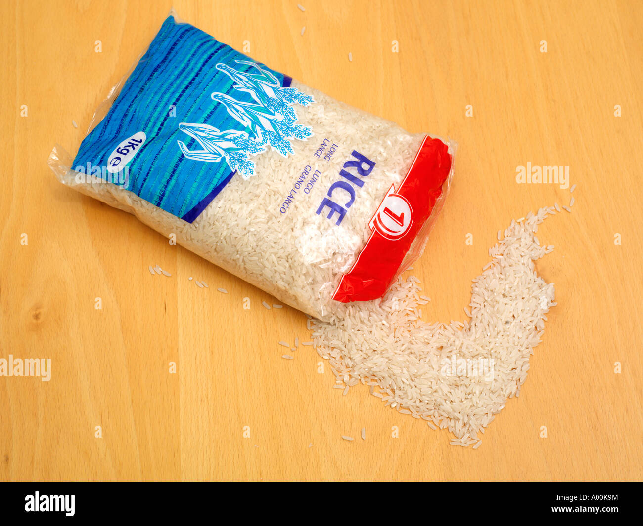 Bag of Long Grain Rice with Some Spilling Out Stock Photo