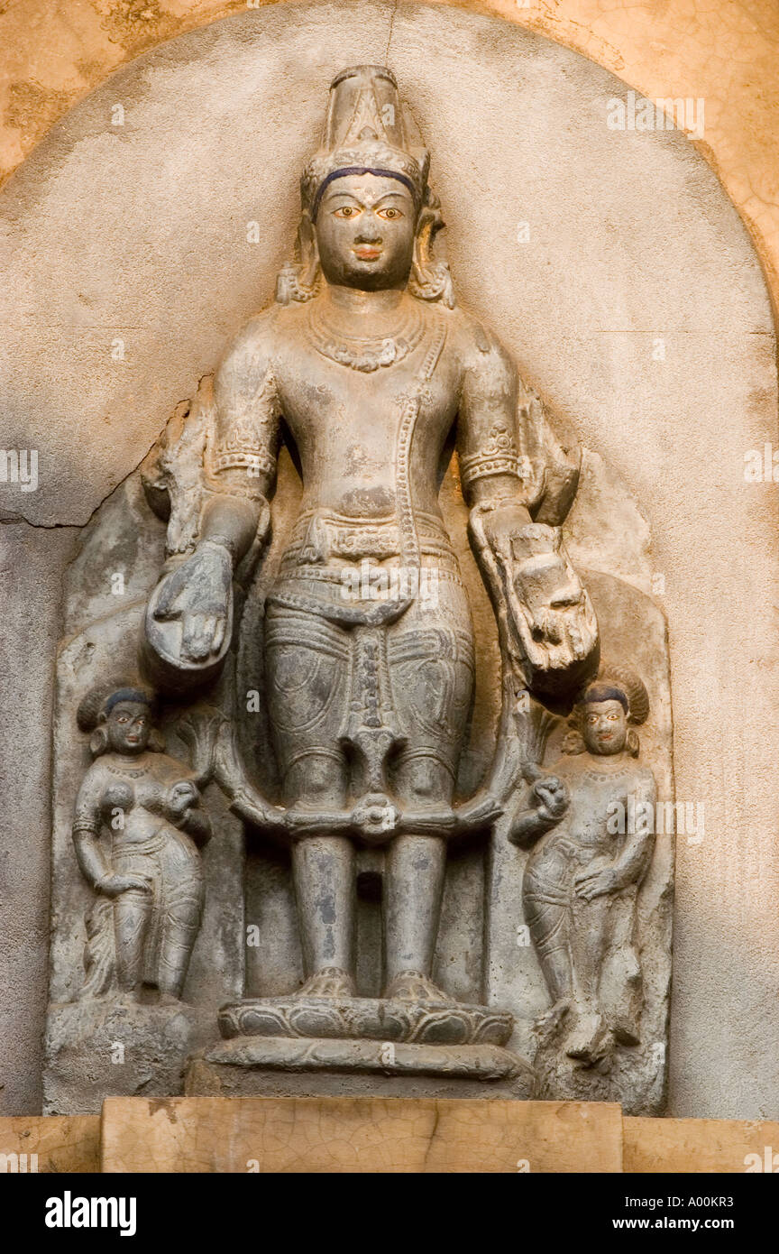 Old Stone buddist statue on the wall of Mahabodhi Mahavihara Bodhgaya ...