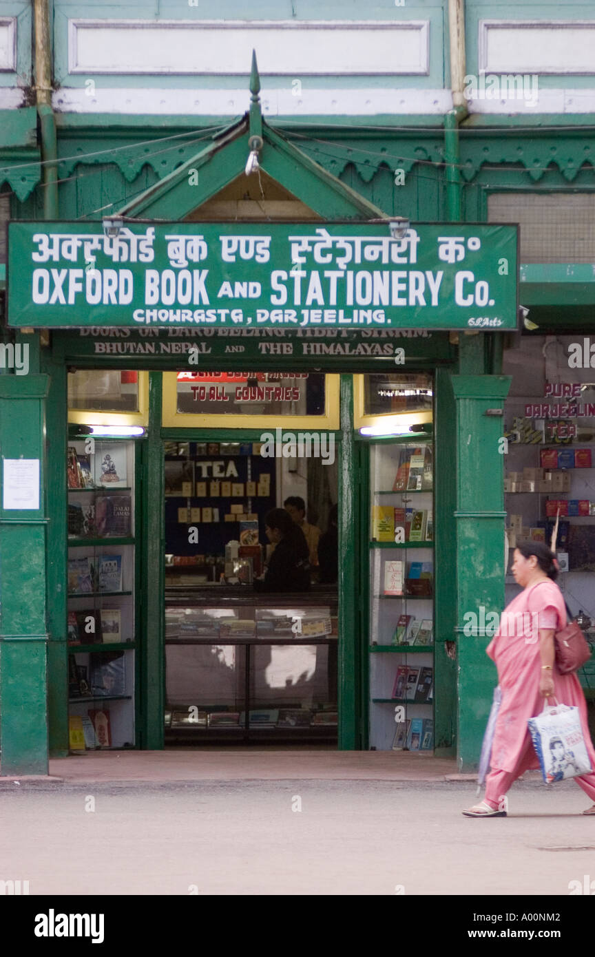 Indian woman passing green Oxford Book Stationery shop on Chowrasta