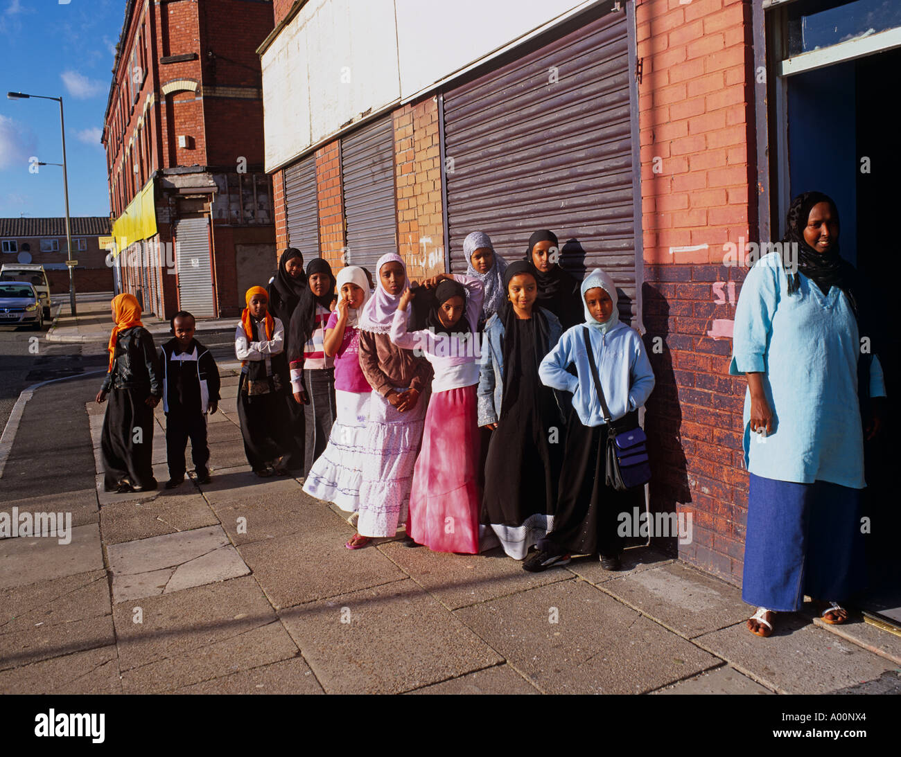 Muslin children queuing for specialist education in Somali Community, Toxteth, Liverpool, UK Stock Photo