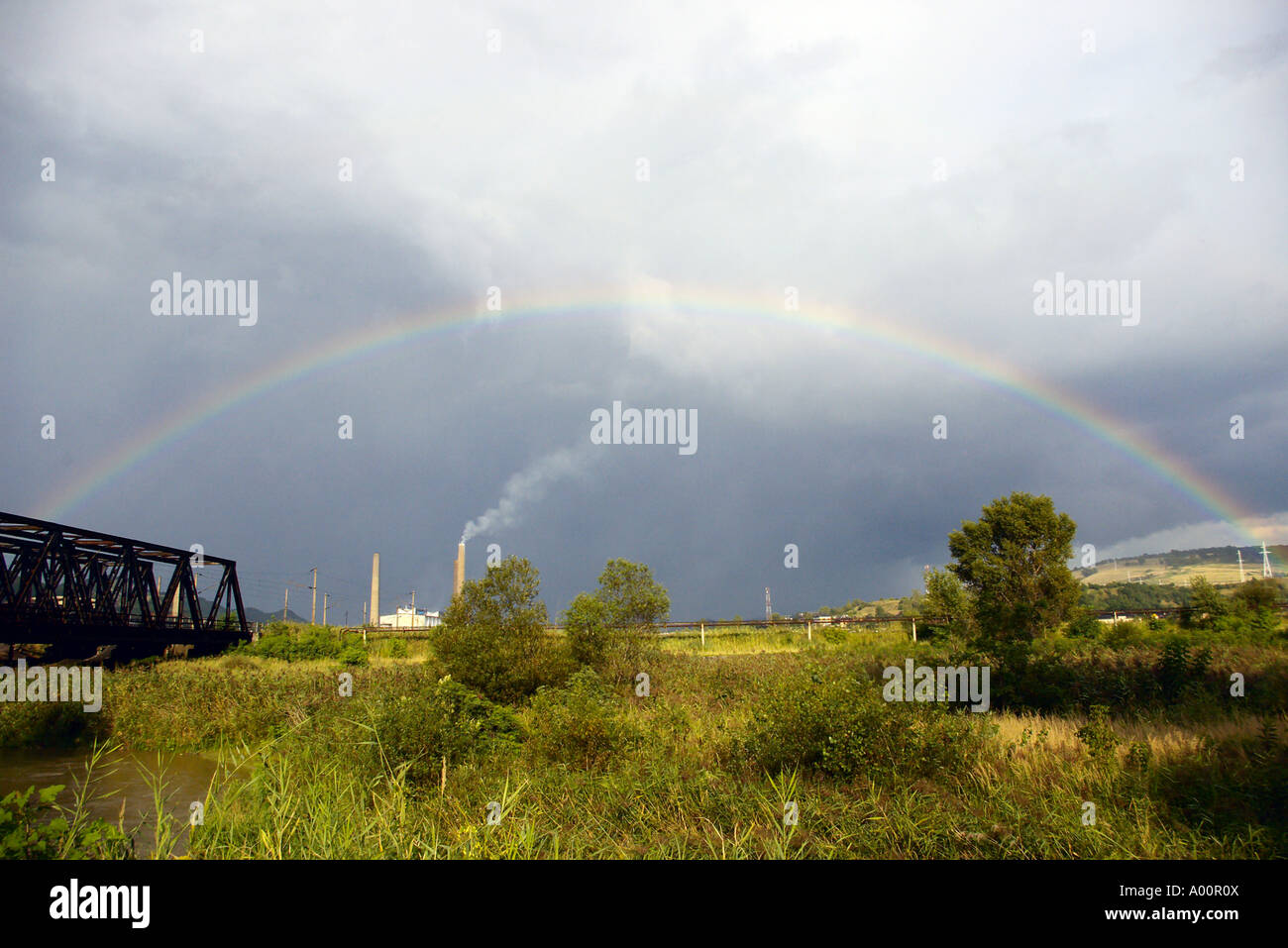 Rainbow over the most polluted town in Europe, Copsa Mica, Romania Stock Photo