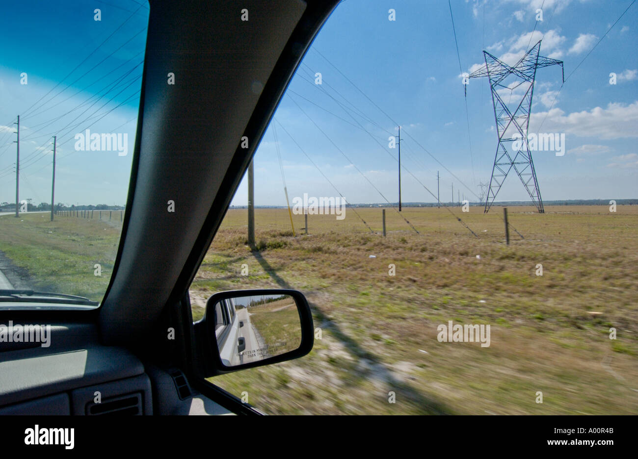 view from inside car of power transmission lines in Florida USA Stock
