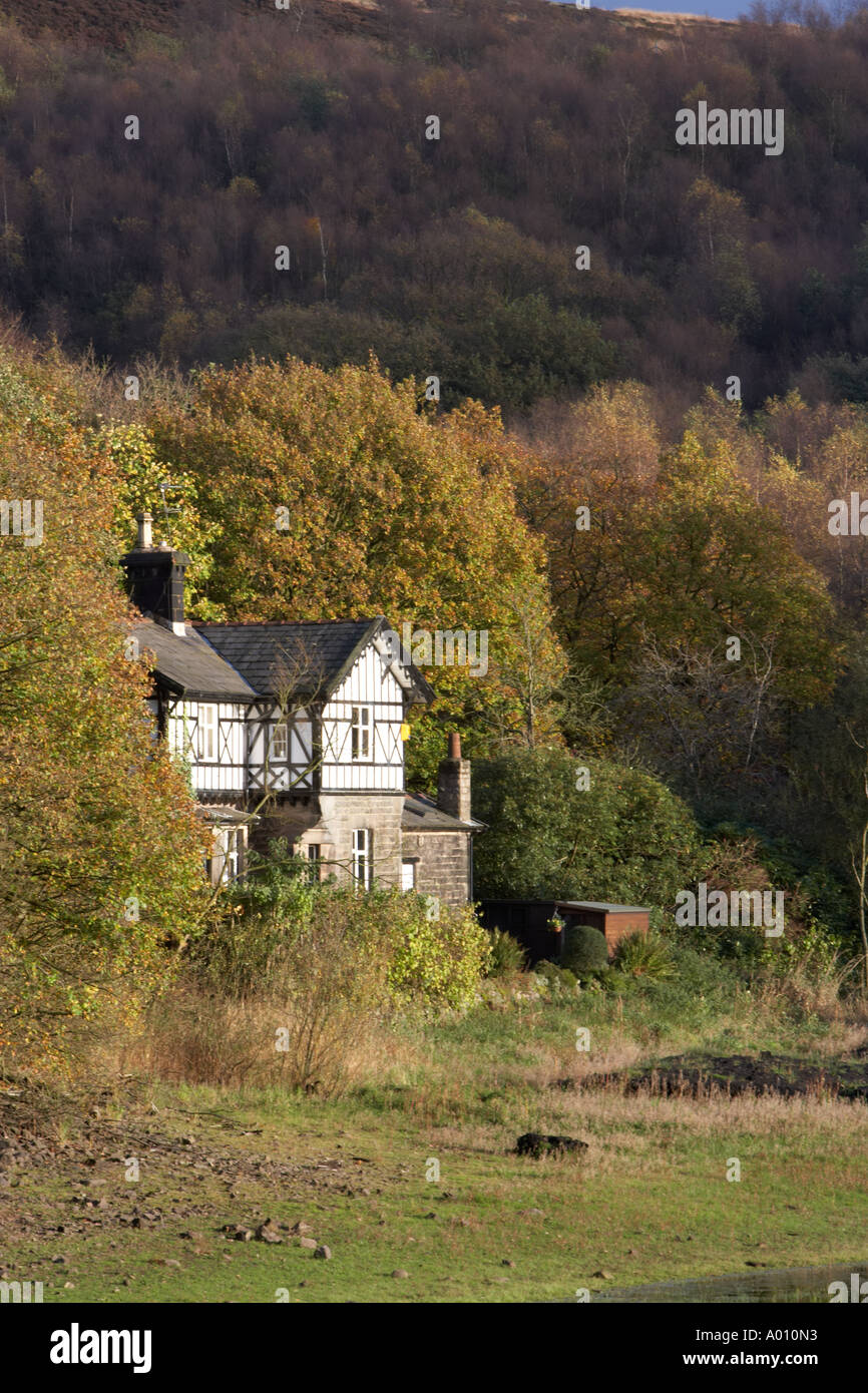 watermans cottage alongside a reservoir near Chorley Lancashire Stock